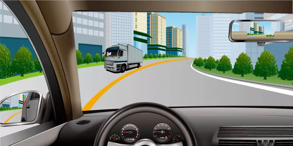 如图所示，驾驶机动车行驶至此路段时，应当减速靠右侧行驶。