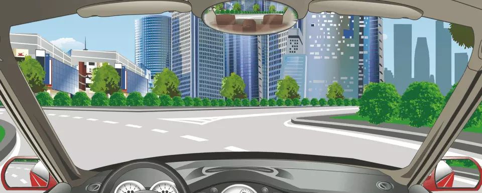 驾驶机动车驶出这个环岛路口怎样使用灯光？