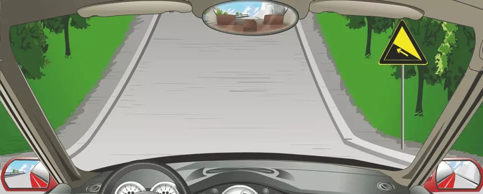 右侧标志警告前方是上陡坡路段。