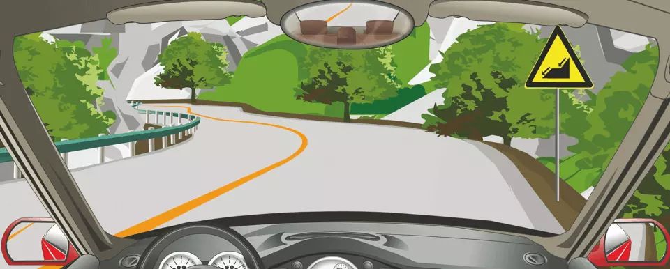 右侧标志警告前方是下陡坡路段。