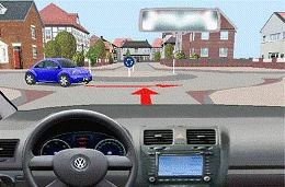 如图所示，自车应当在环岛内的车辆前方驶入环岛。